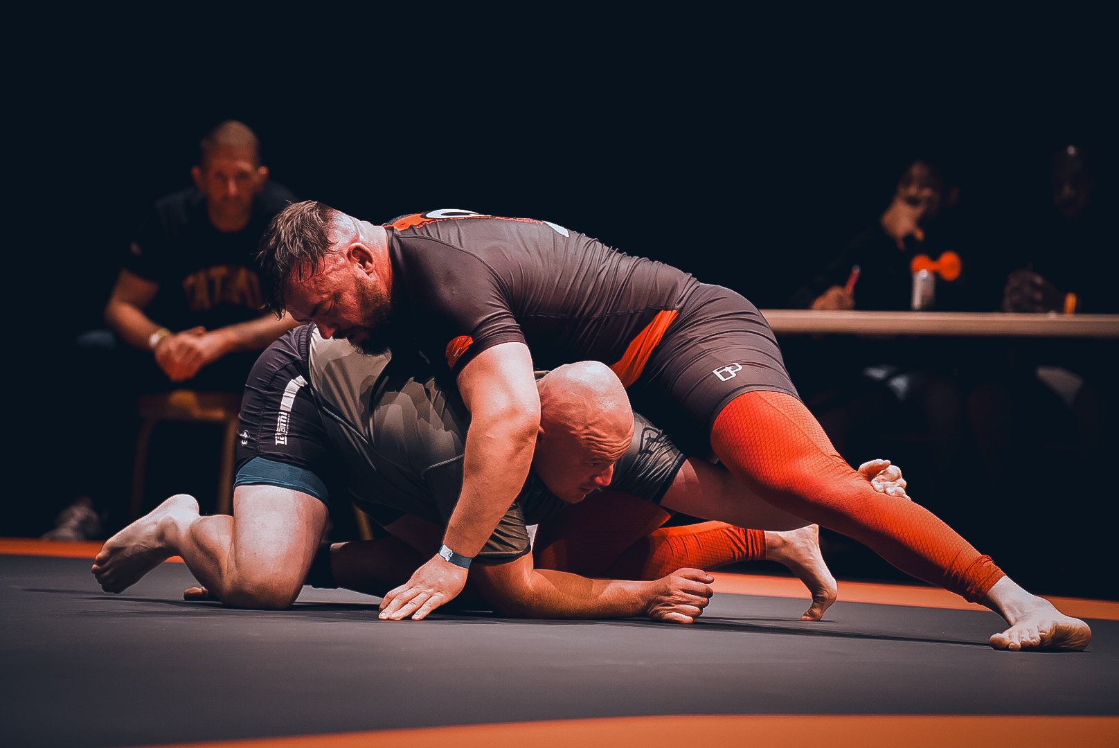 Scramble exchange between two heavyweight grapplers